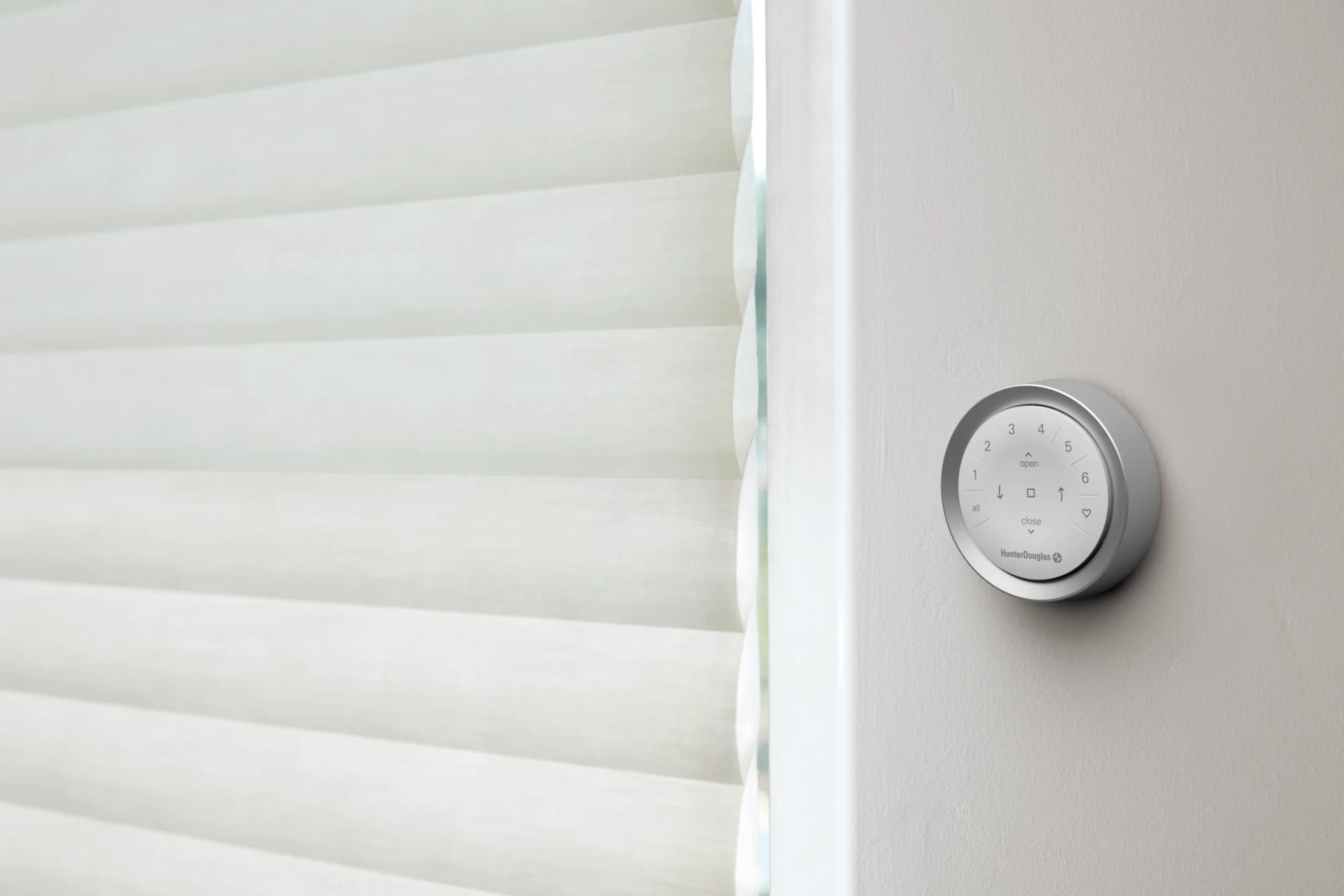 Airy Hunter Douglas Luminette® Privacy Sheers with an ocean view, controlled by PowerView® Automation.