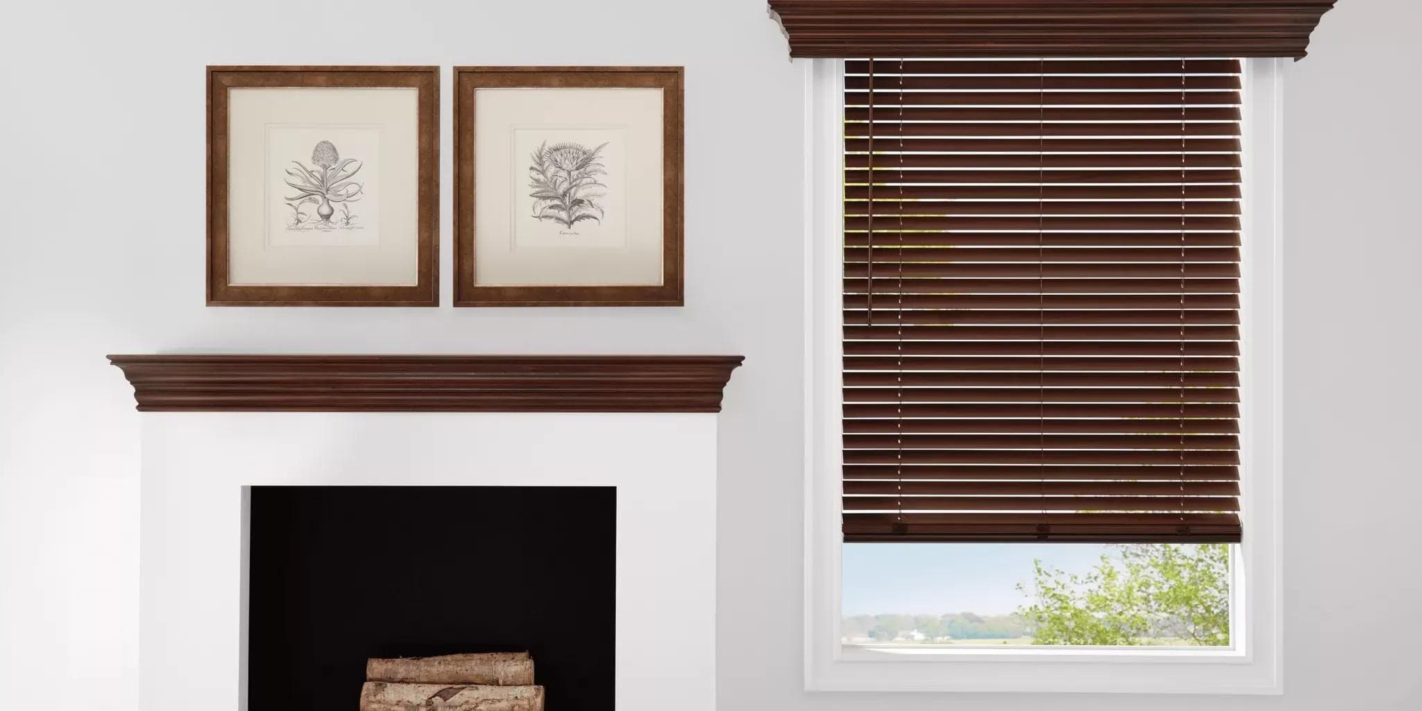 Warm wood blinds installed over a fireplace, the kind of Hunter Douglas product Jim services and repairs.
