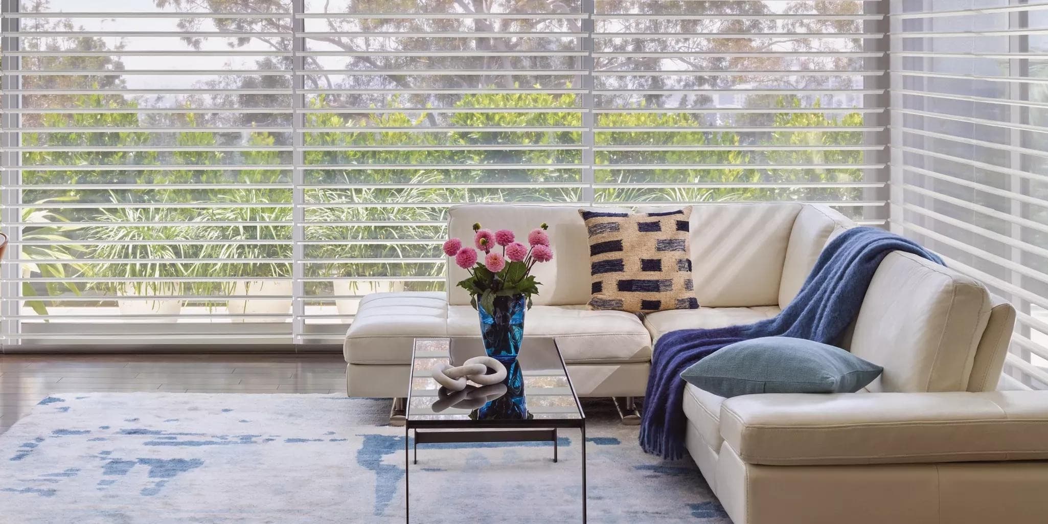 A premium New England living room with Hunter Douglas Silhouette sheer shades softening the daylight.