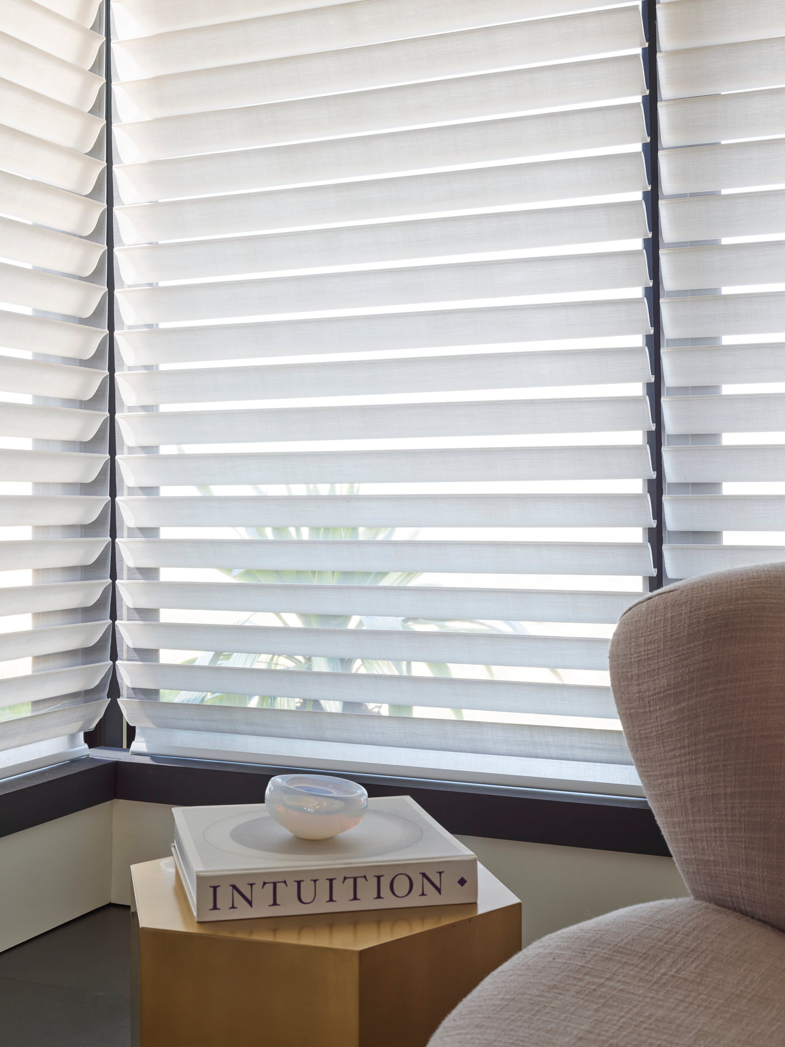 A premium New England living room with Hunter Douglas Silhouette® Window Shadings softening the daylight.