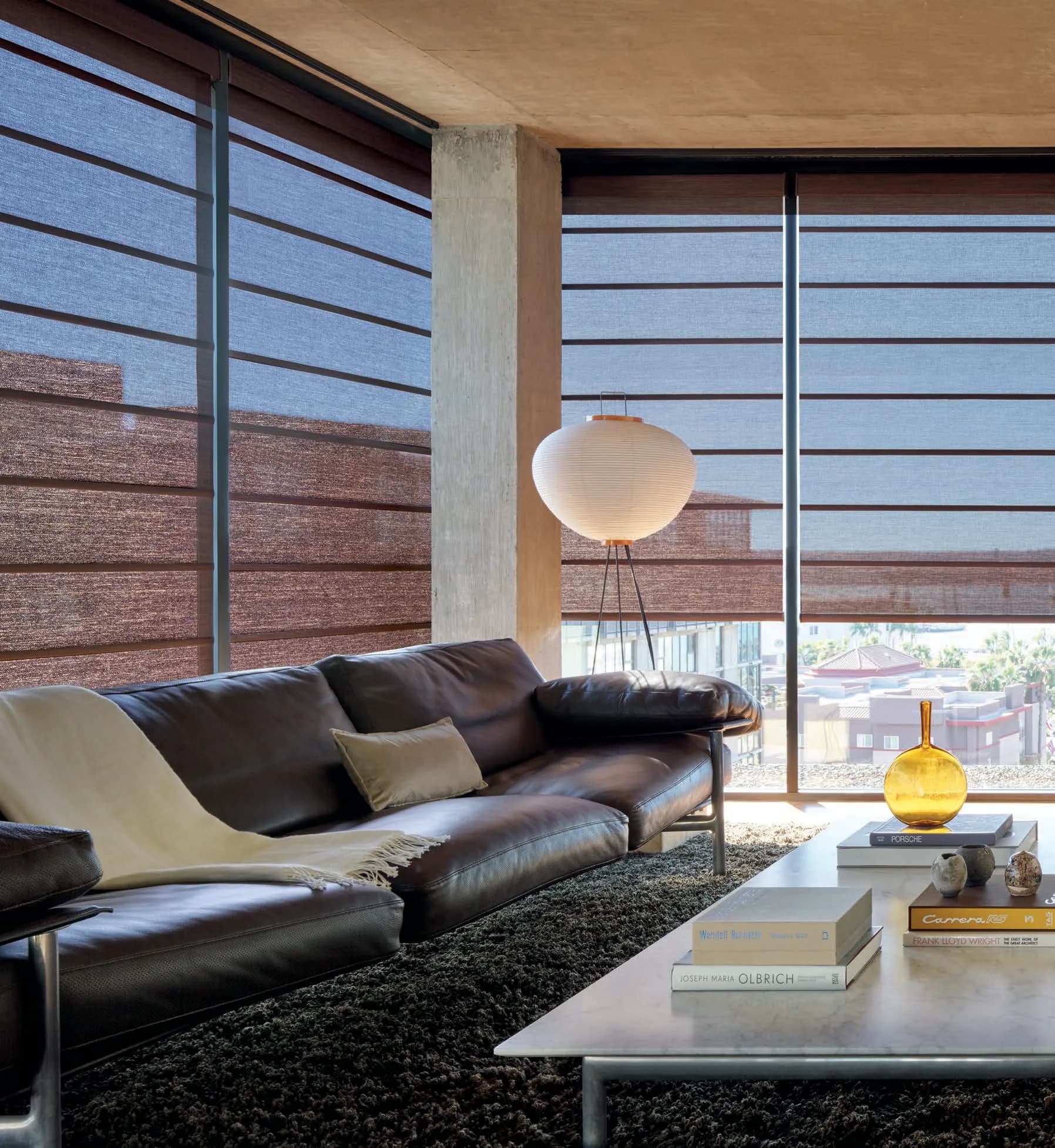 Alustra® Architectural Roller Shades in Hunter Douglas's Brielle fabric, color Ascot, operated with PowerView® Automation.
