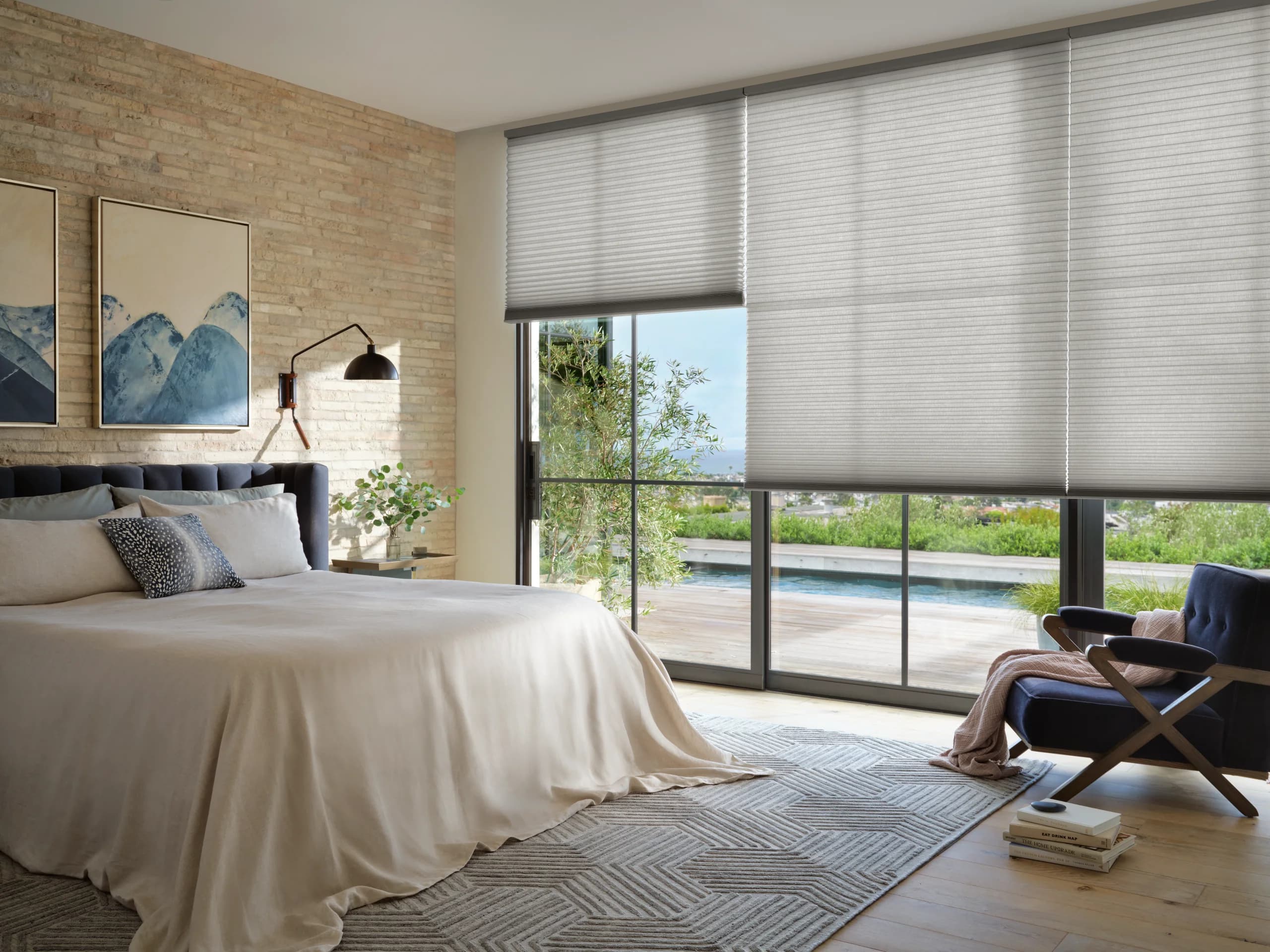 Hunter Douglas Applause® Honeycomb Shades covering a bedroom window for privacy and insulation.