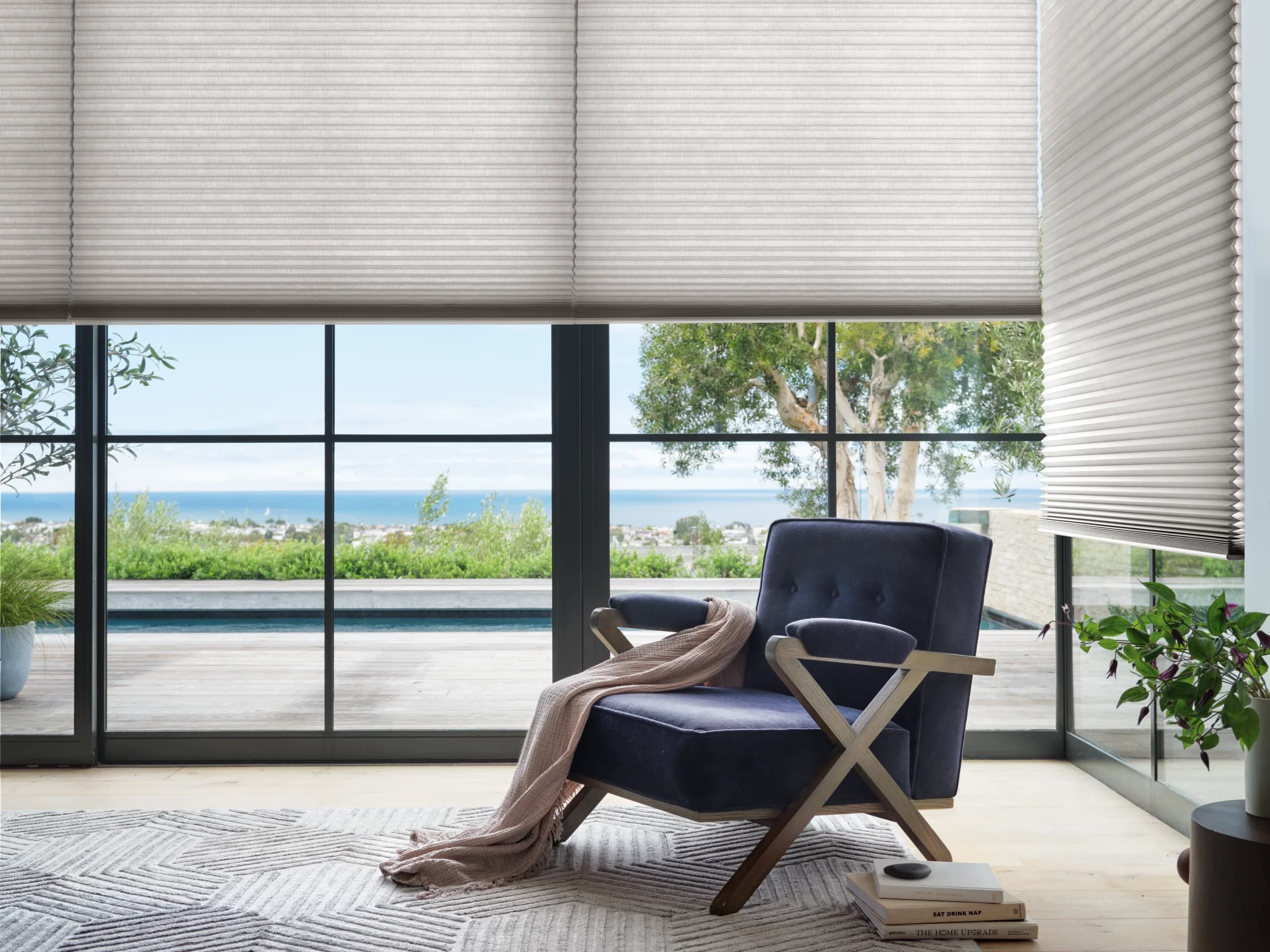 Close view of Hunter Douglas Applause® Honeycomb Shades in a bedroom, the honeycomb cells catching morning light.