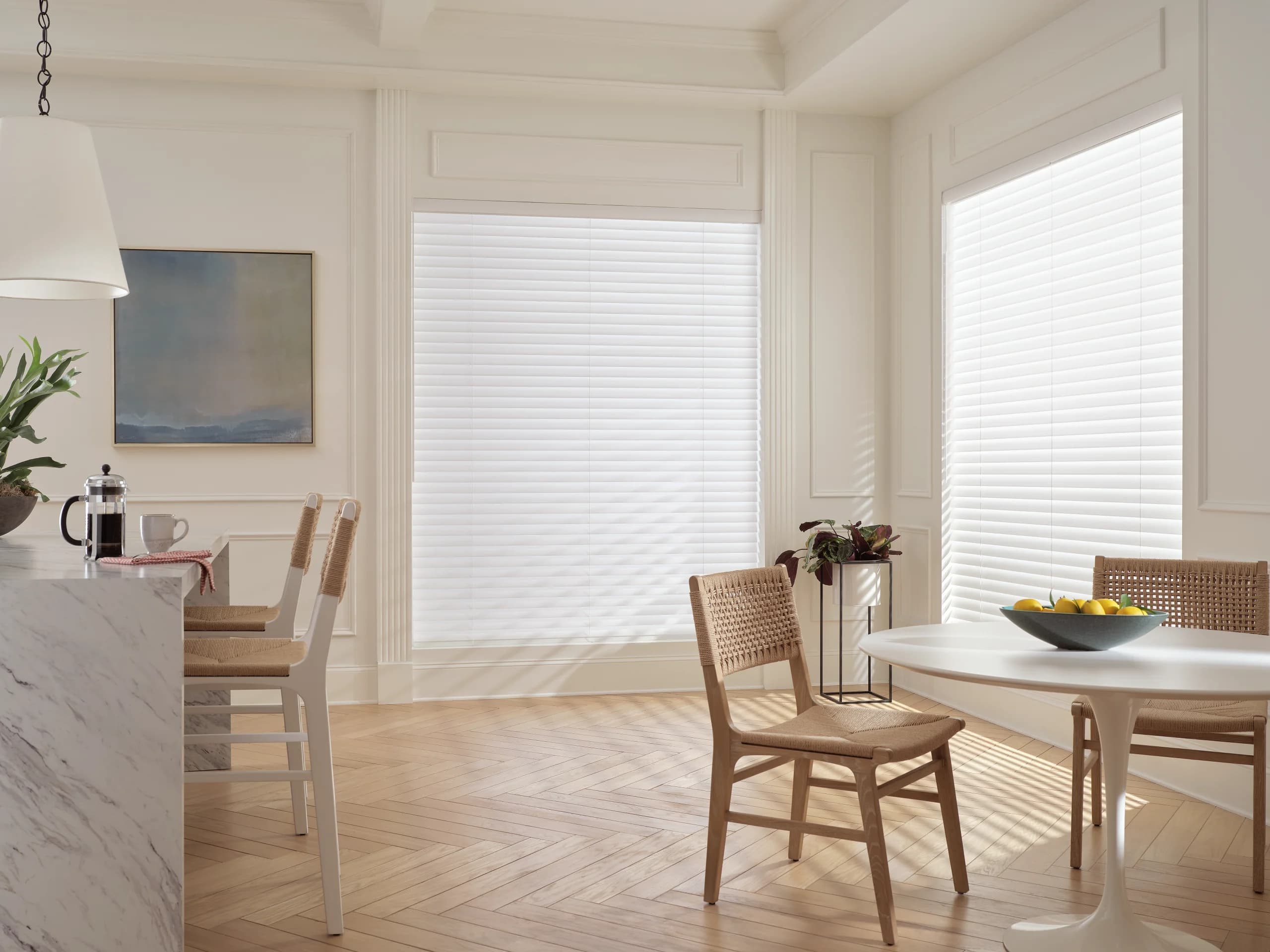 Hunter Douglas Aria™ Soft Blinds in white over a kitchen window, softening the midday light.