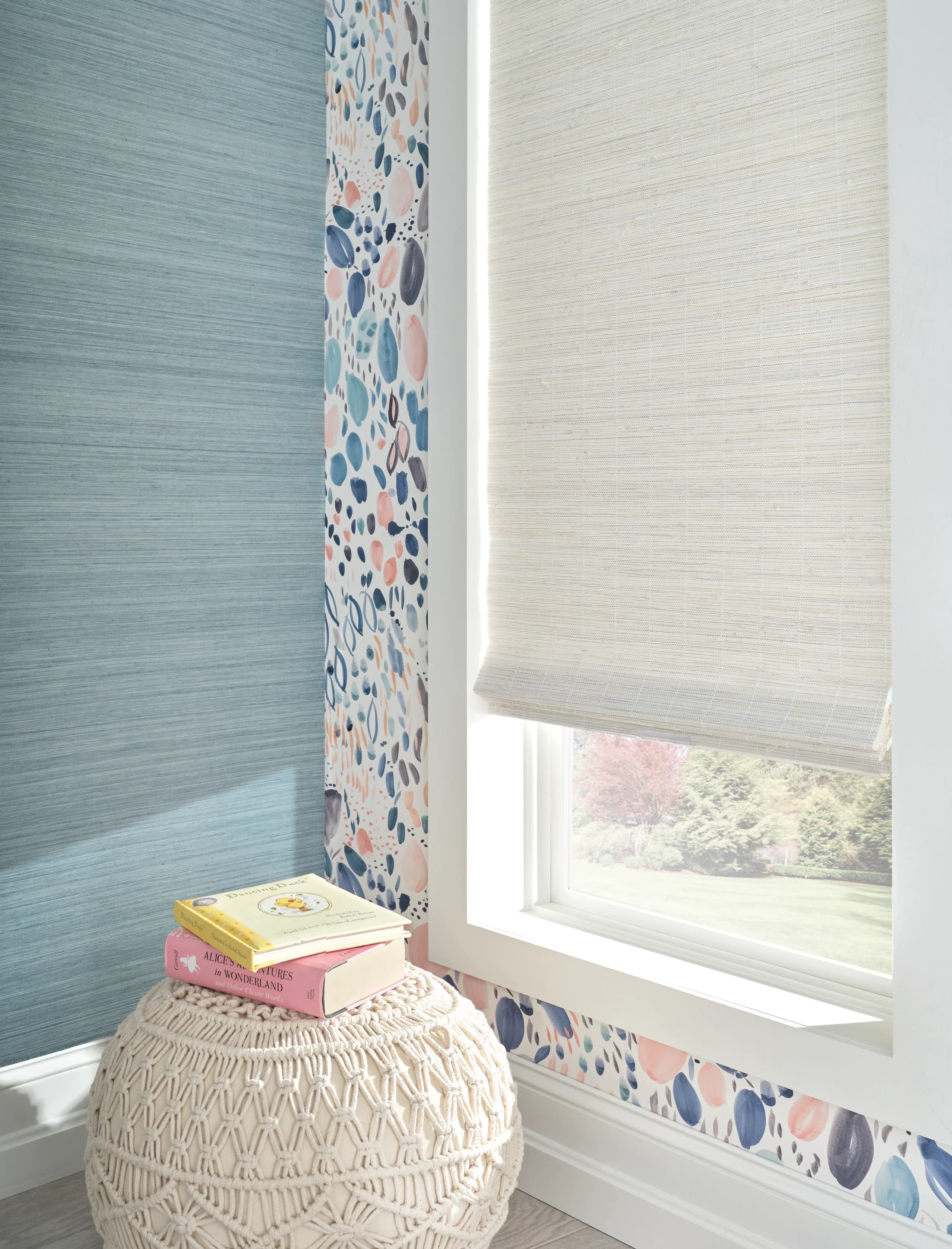 Hunter Douglas Provenance® Woven Wood Shades in a warm, light-filled child's room.