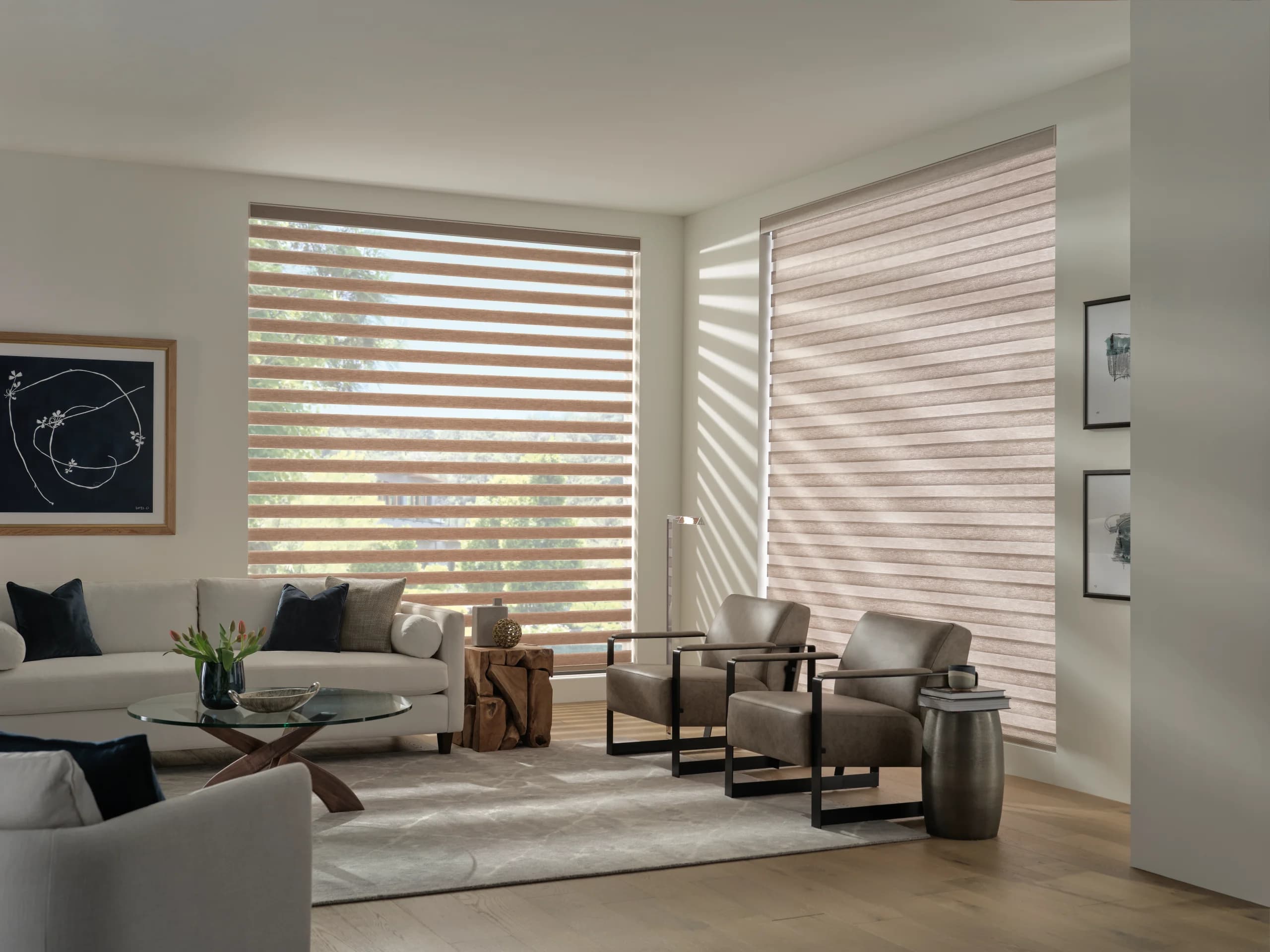 The same living room with one Designer Banded Shade open to the view and the second staggered closed for privacy.