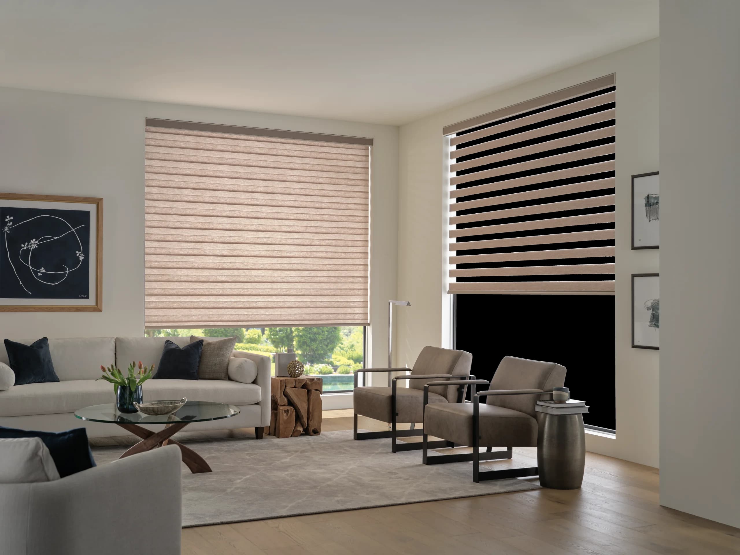 Designer Banded Shades in a living room with the left shade lowered to solid bands and the right shade raised partway.