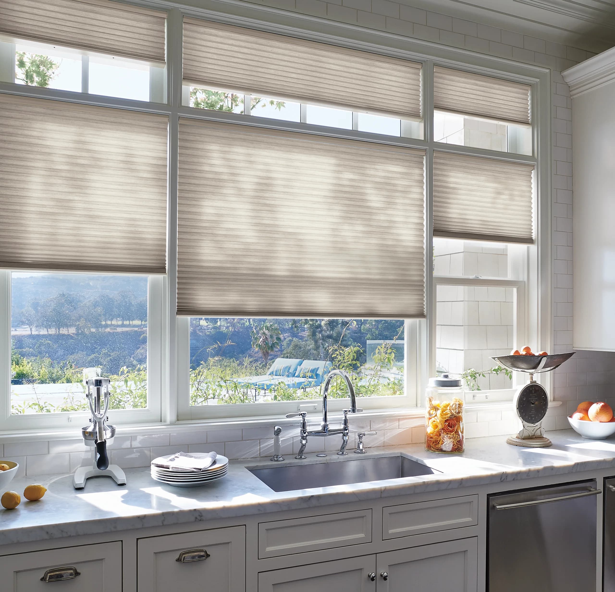 Hunter Douglas Duette® Honeycomb Shades in a bright kitchen.