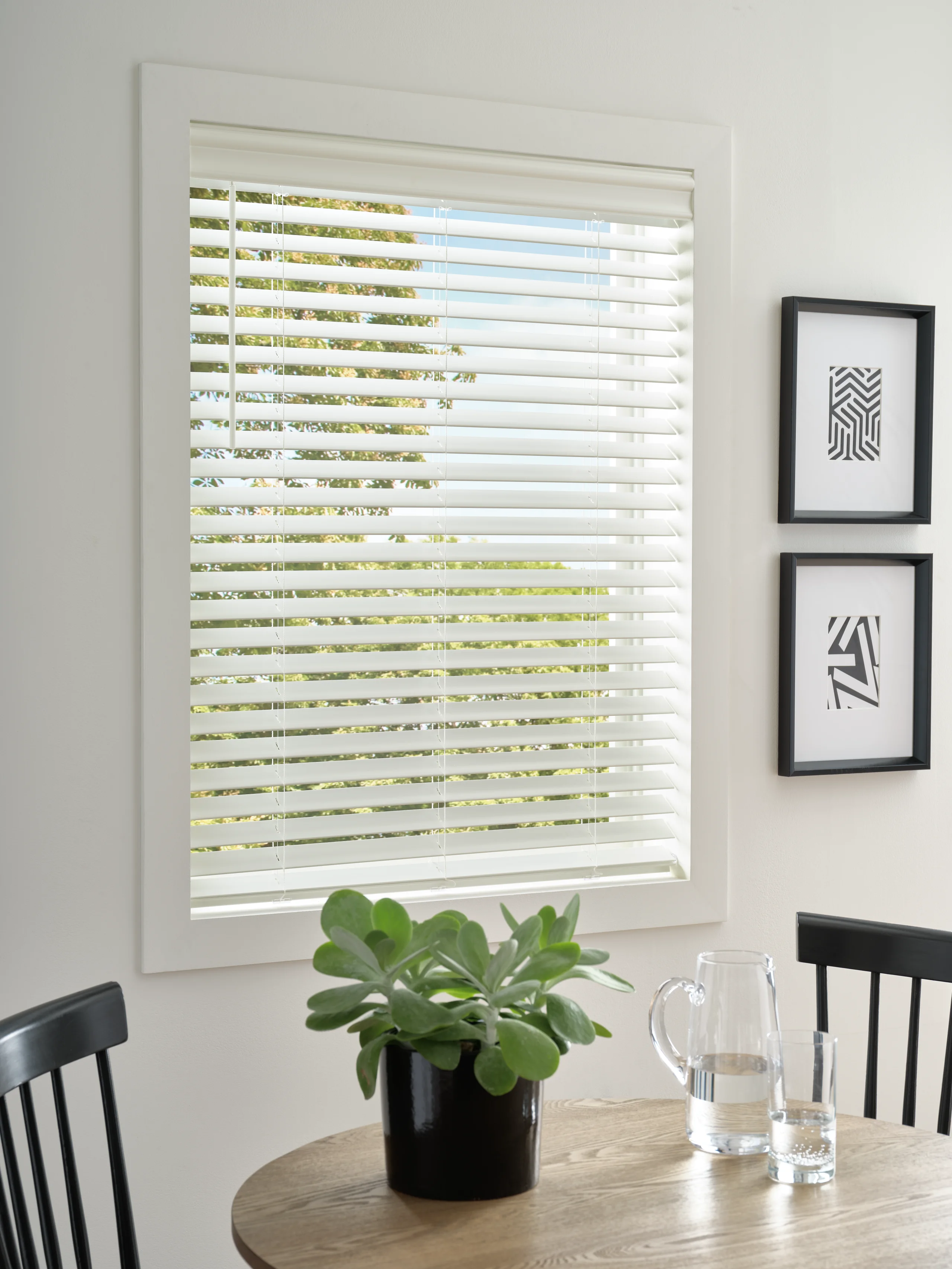 Hunter Douglas EverWood® Alternative Wood Blinds in a sunny breakfast nook.