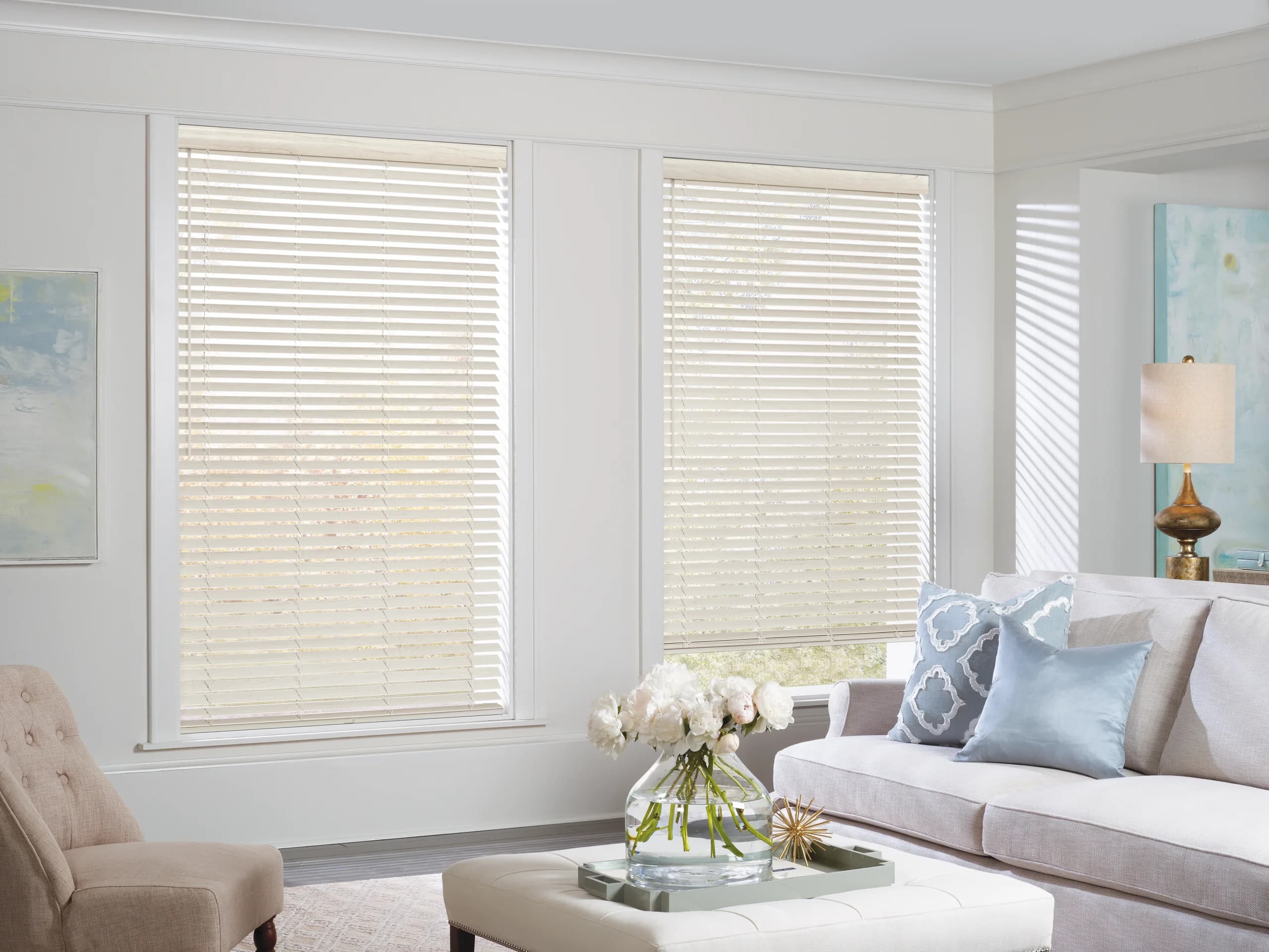 Hunter Douglas EverWood® Alternative Wood Blinds across a bright living room window.