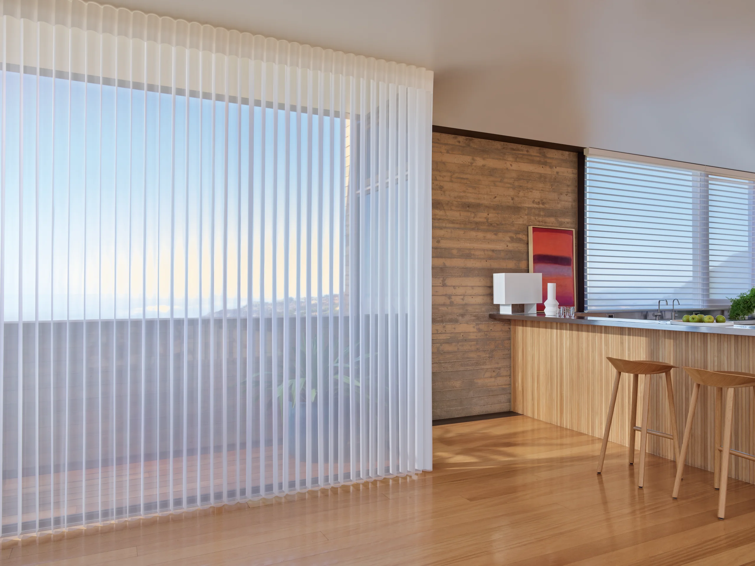 Hunter Douglas Luminette® Privacy Sheers drawn across a wide kitchen window.