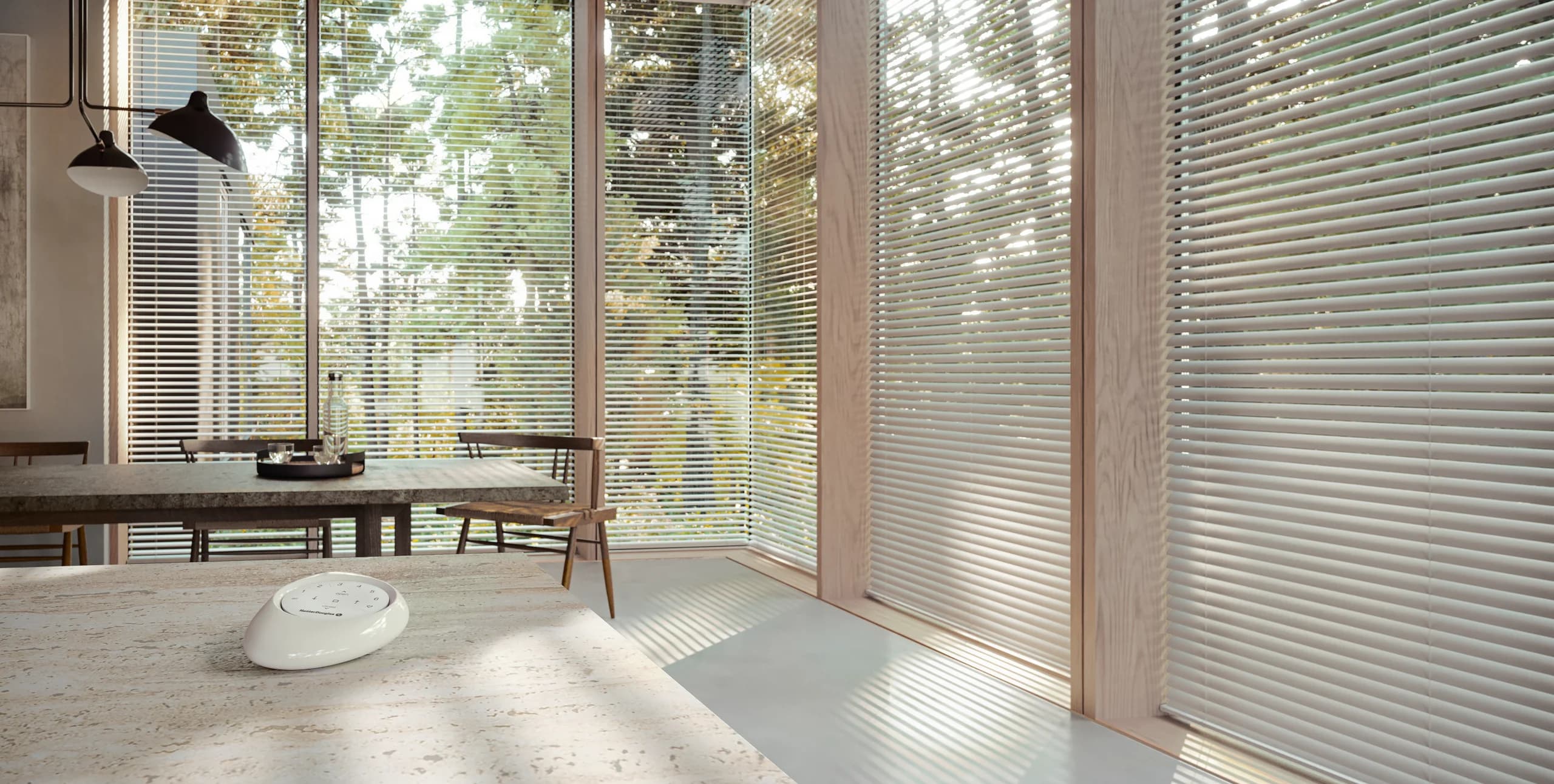 Hunter Douglas Modern Precious Metals® Aluminum Blinds tilted open over a kitchen window.