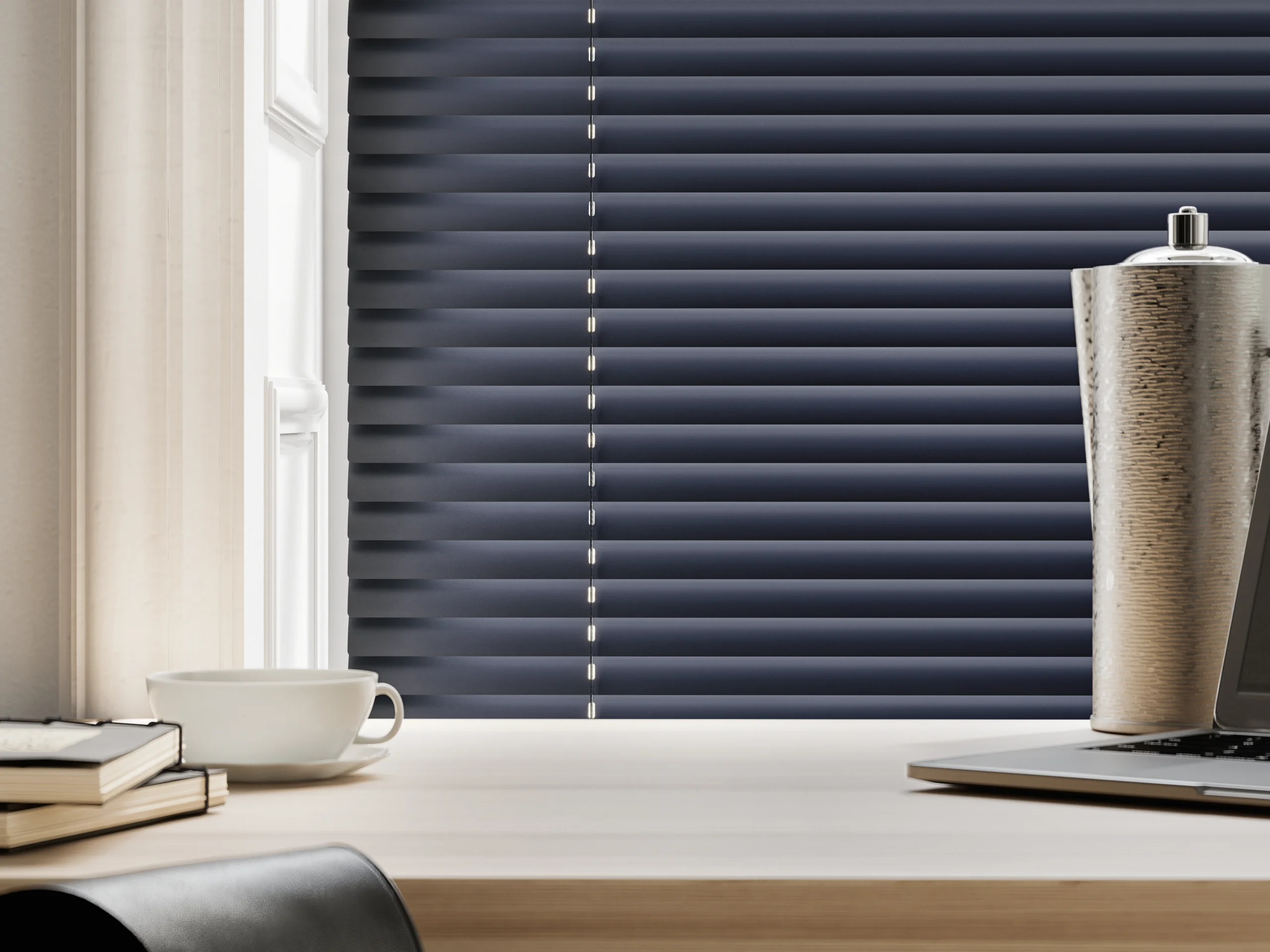 A close view of the slats on Hunter Douglas Modern Precious Metals® Aluminum Blinds in a home office.