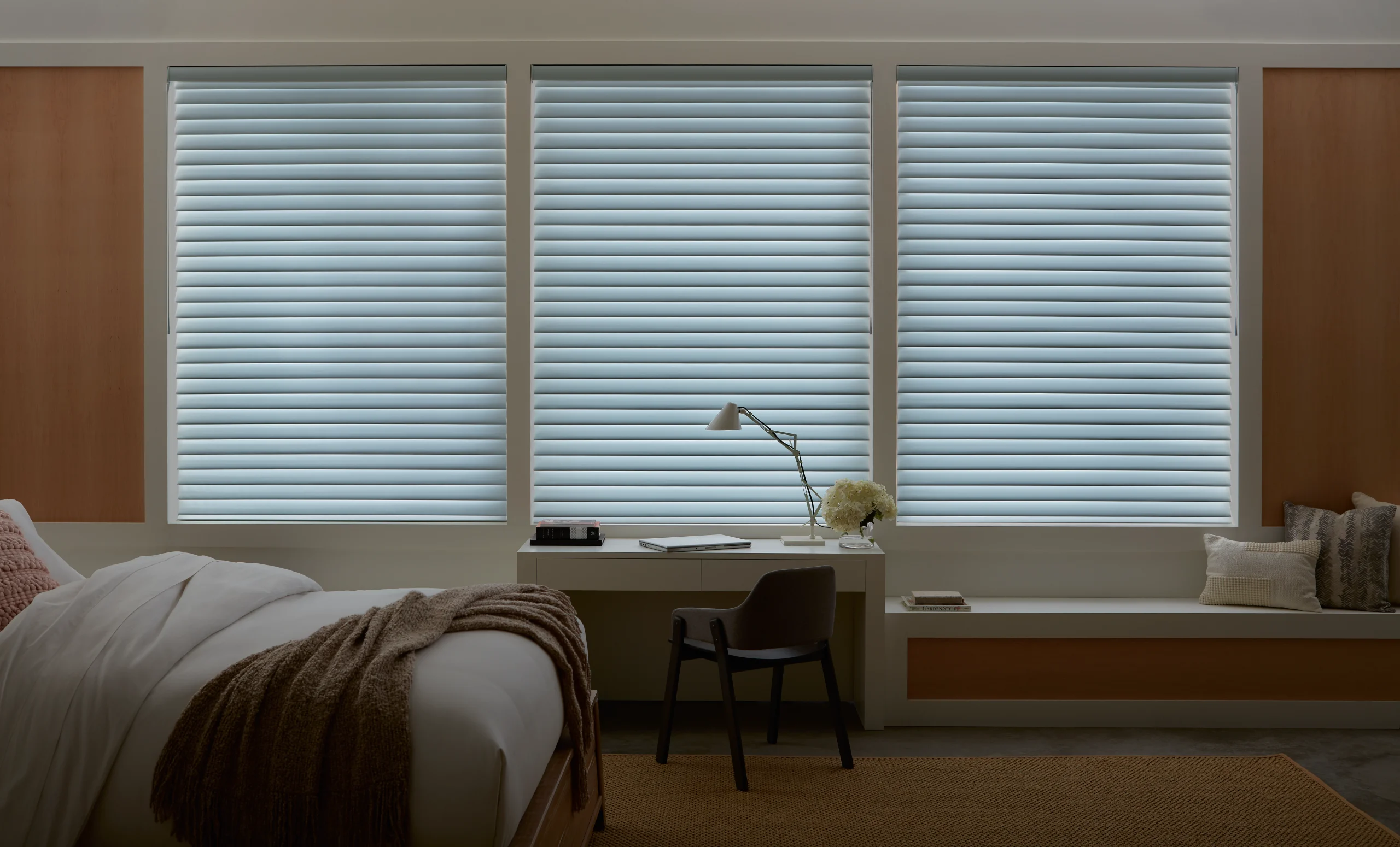 Hunter Douglas Nantucket™ Window Shadings closed for privacy in a quiet bedroom.
