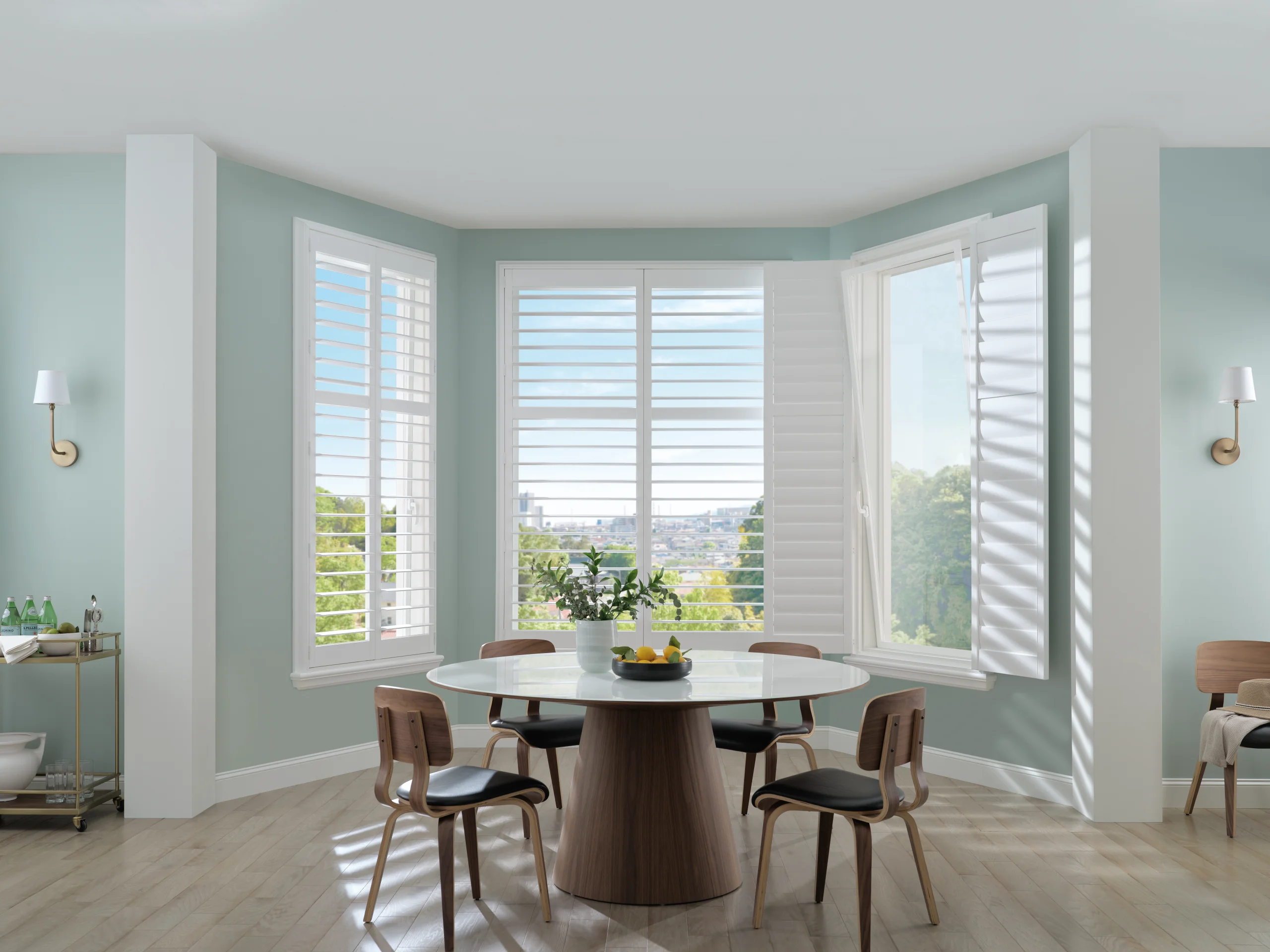 Hunter Douglas Palm Beach™ Polysatin™ Shutters in a dining room, with one panel swung open and the window tilted open behind it.