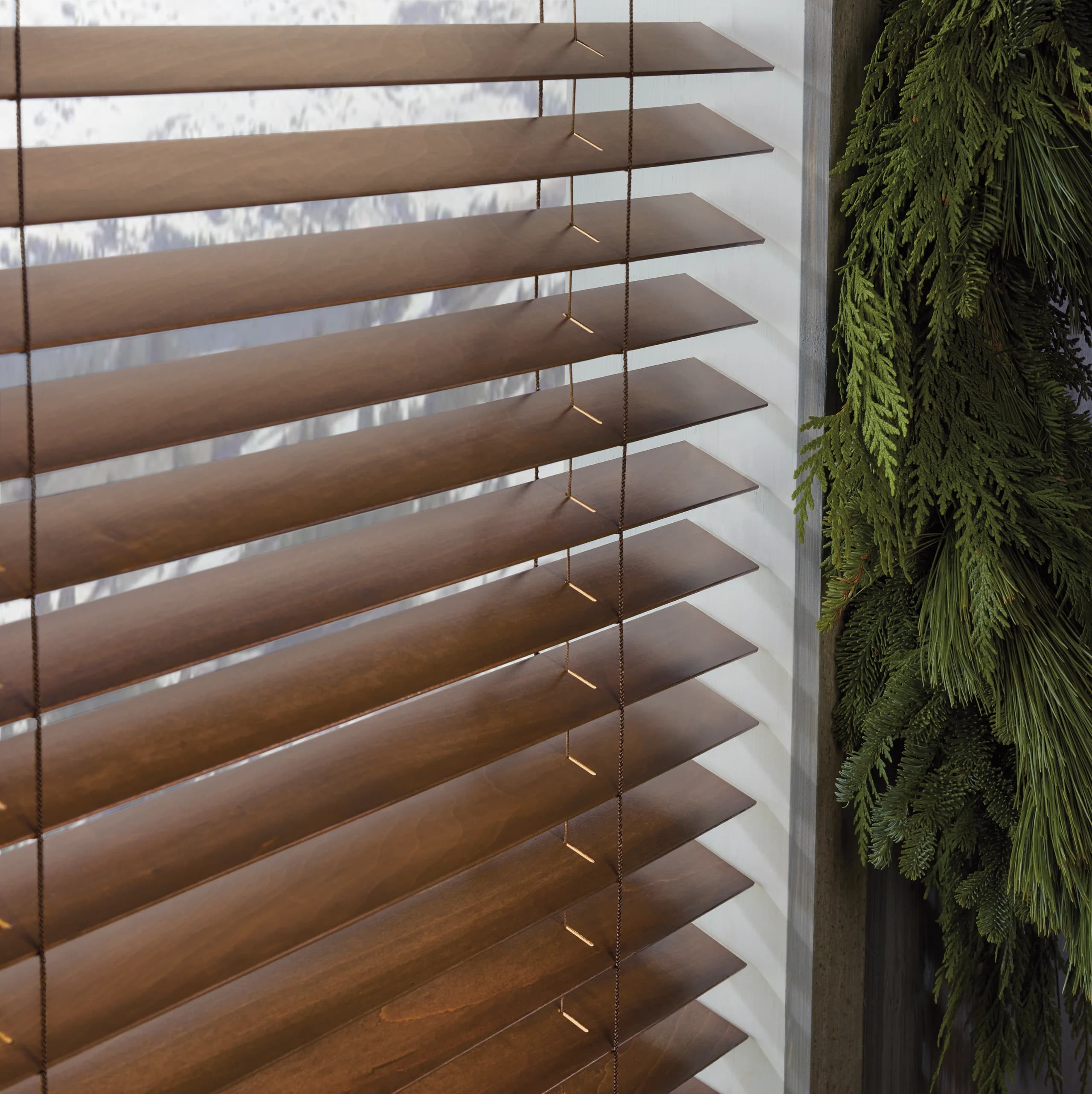 A close view of the headrail and hardware on Hunter Douglas Parkland® Wood Blinds.