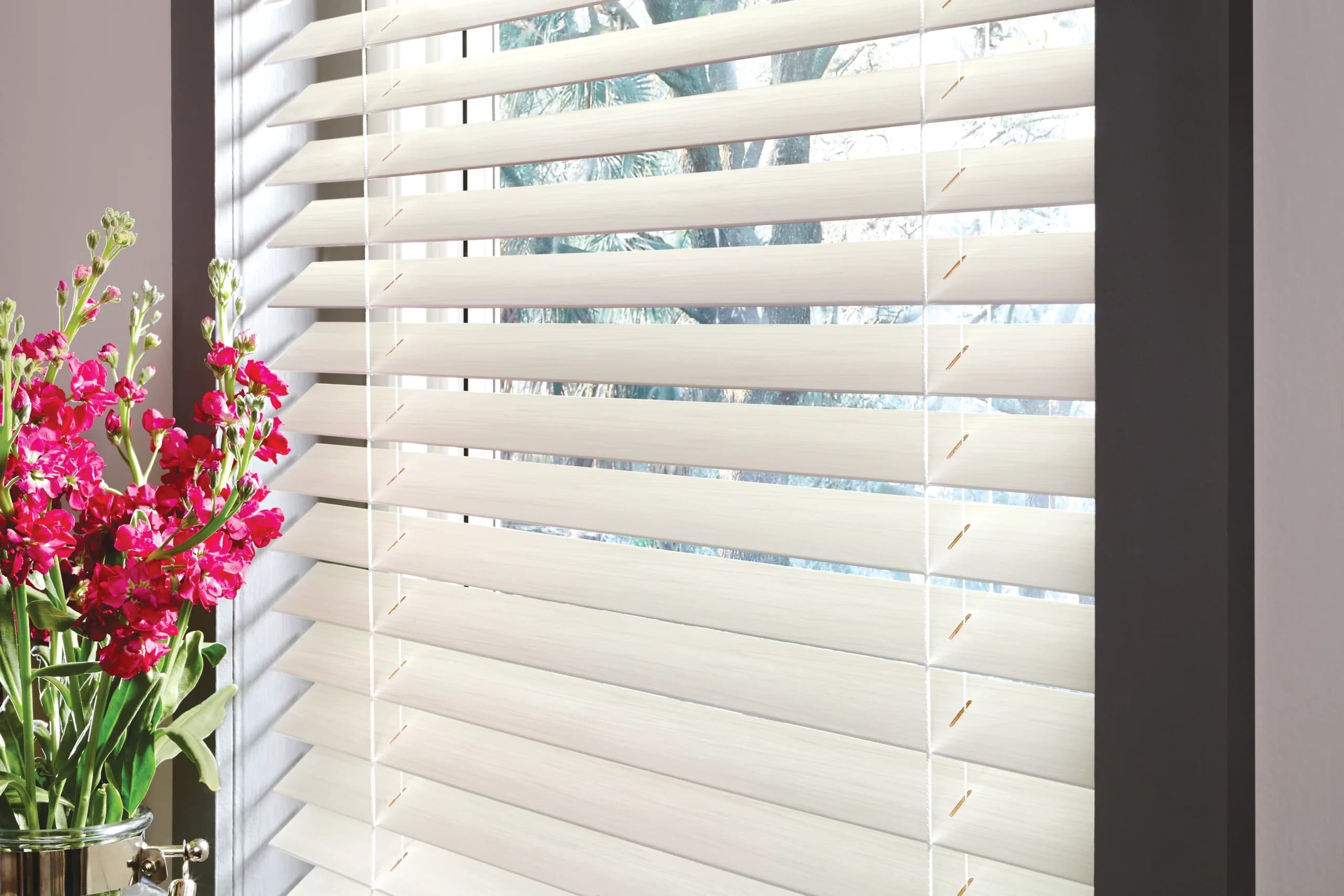 A close view of the slats on Hunter Douglas Parkland® Wood Blinds, showing the wood grain under the stain.