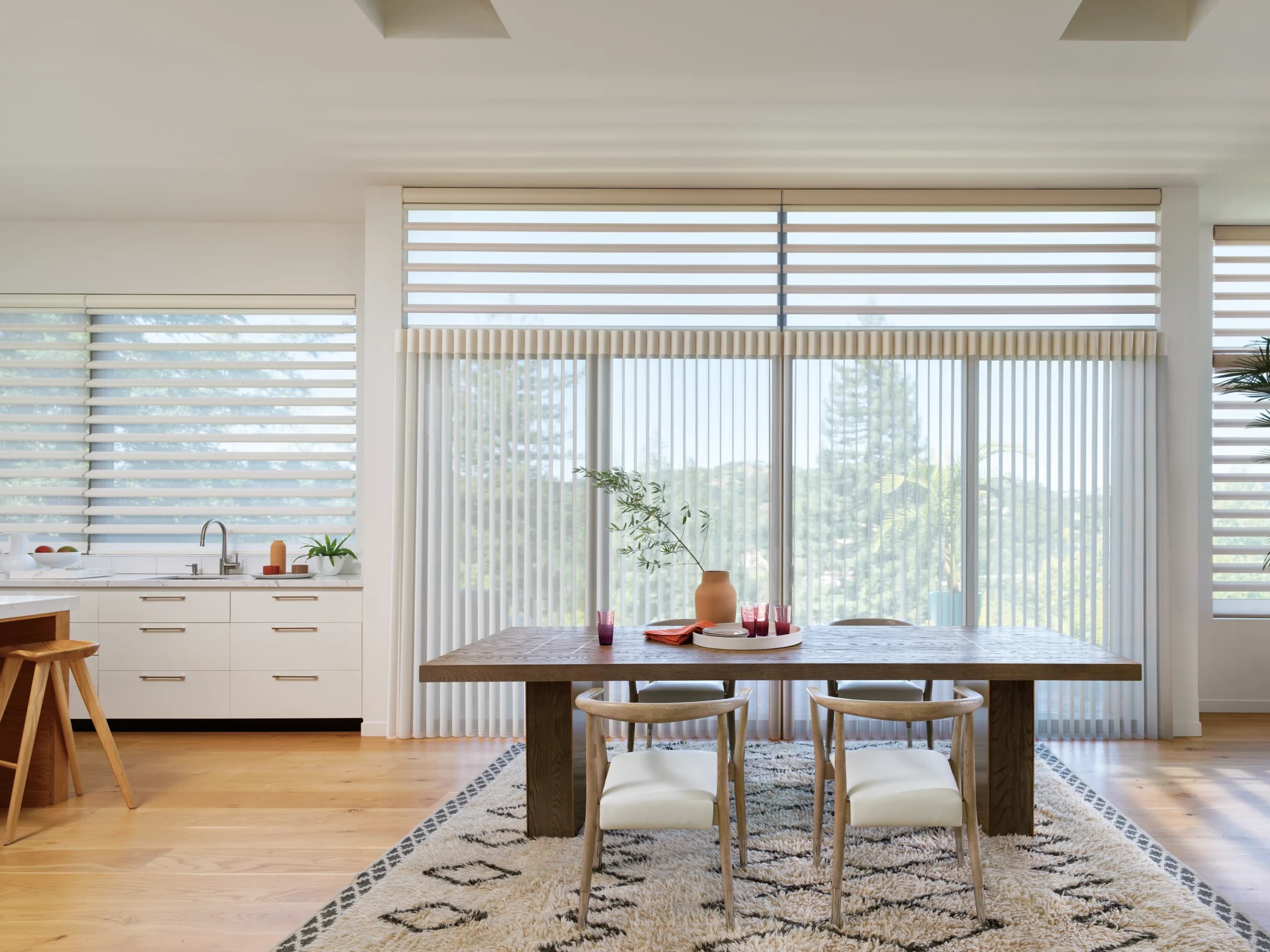 Hunter Douglas Pirouette® Window Shadings softening daylight over a kitchen window.