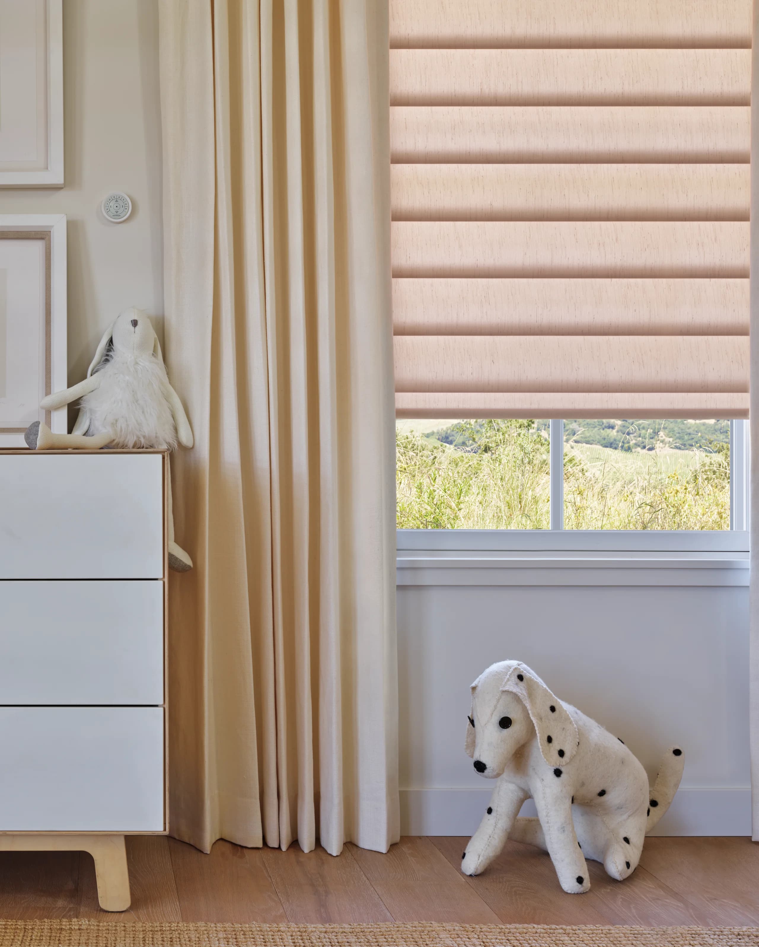 Close view of Hunter Douglas Pirouette® Window Shadings closed in a nursery, showing the contoured fabric vanes.
