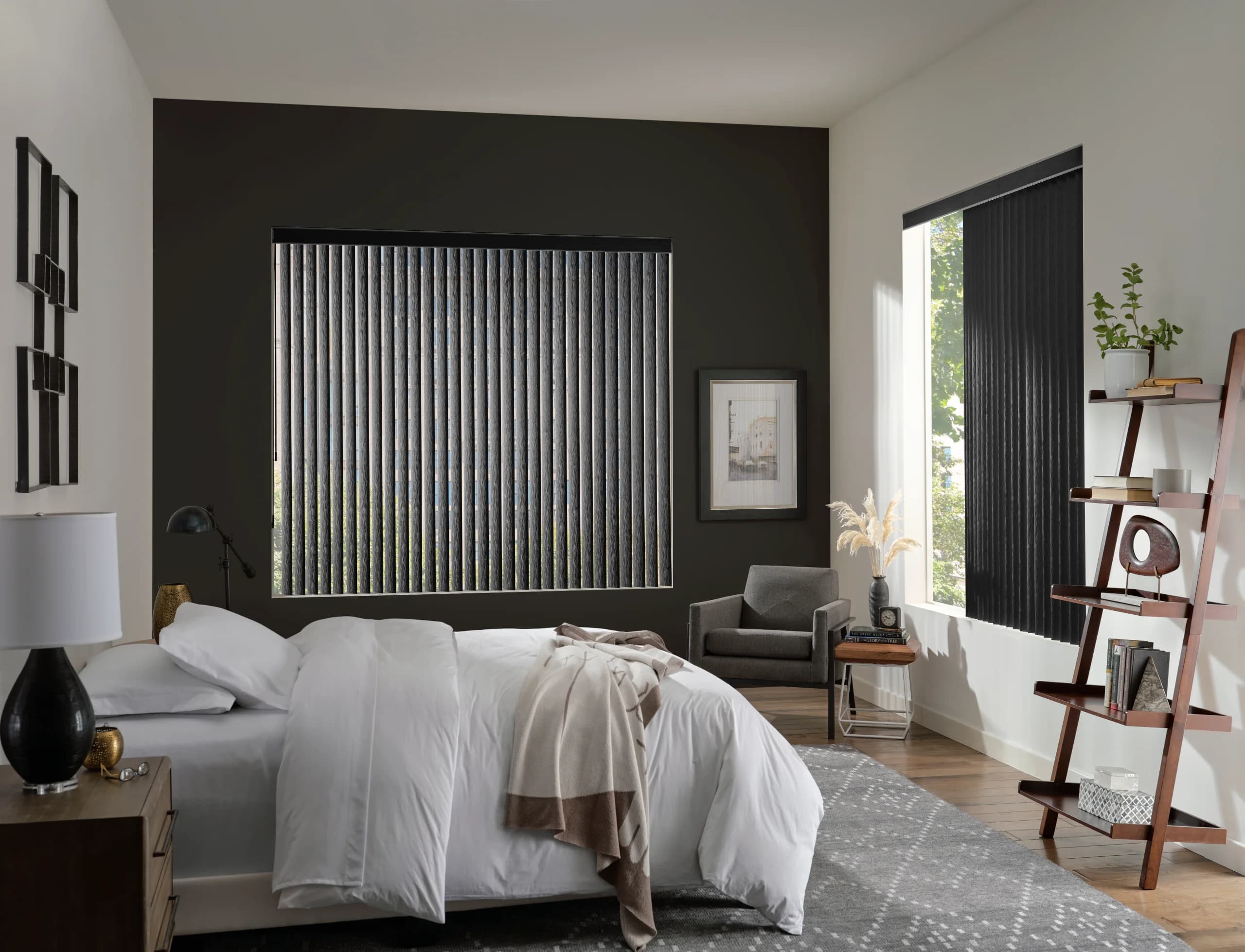 Hunter Douglas Somner® Custom Vertical Blinds in a deep raven tone closed across a bedroom window.