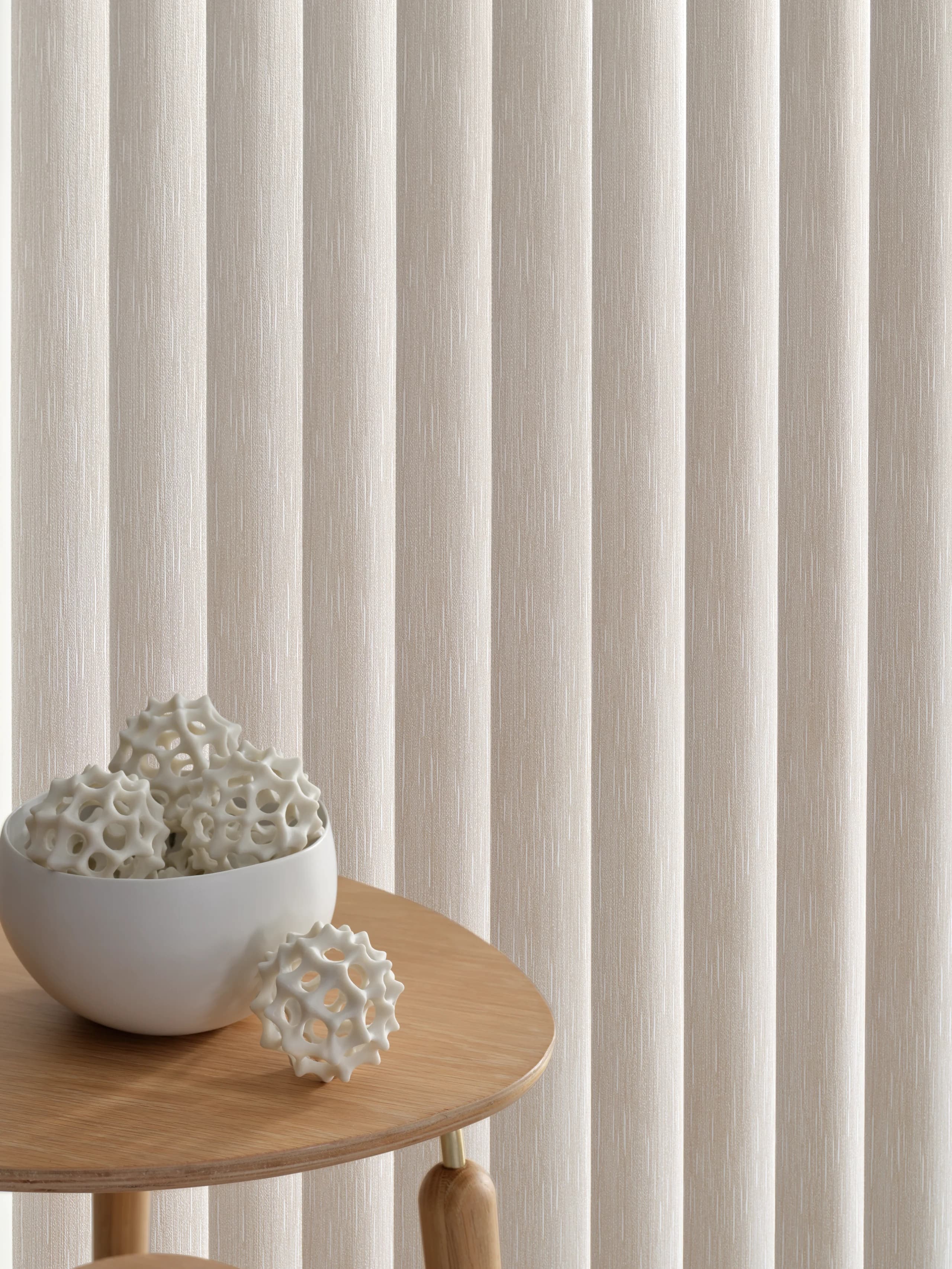 A close view of the vinyl louvers on Hunter Douglas Somner® Custom Vertical Blinds.