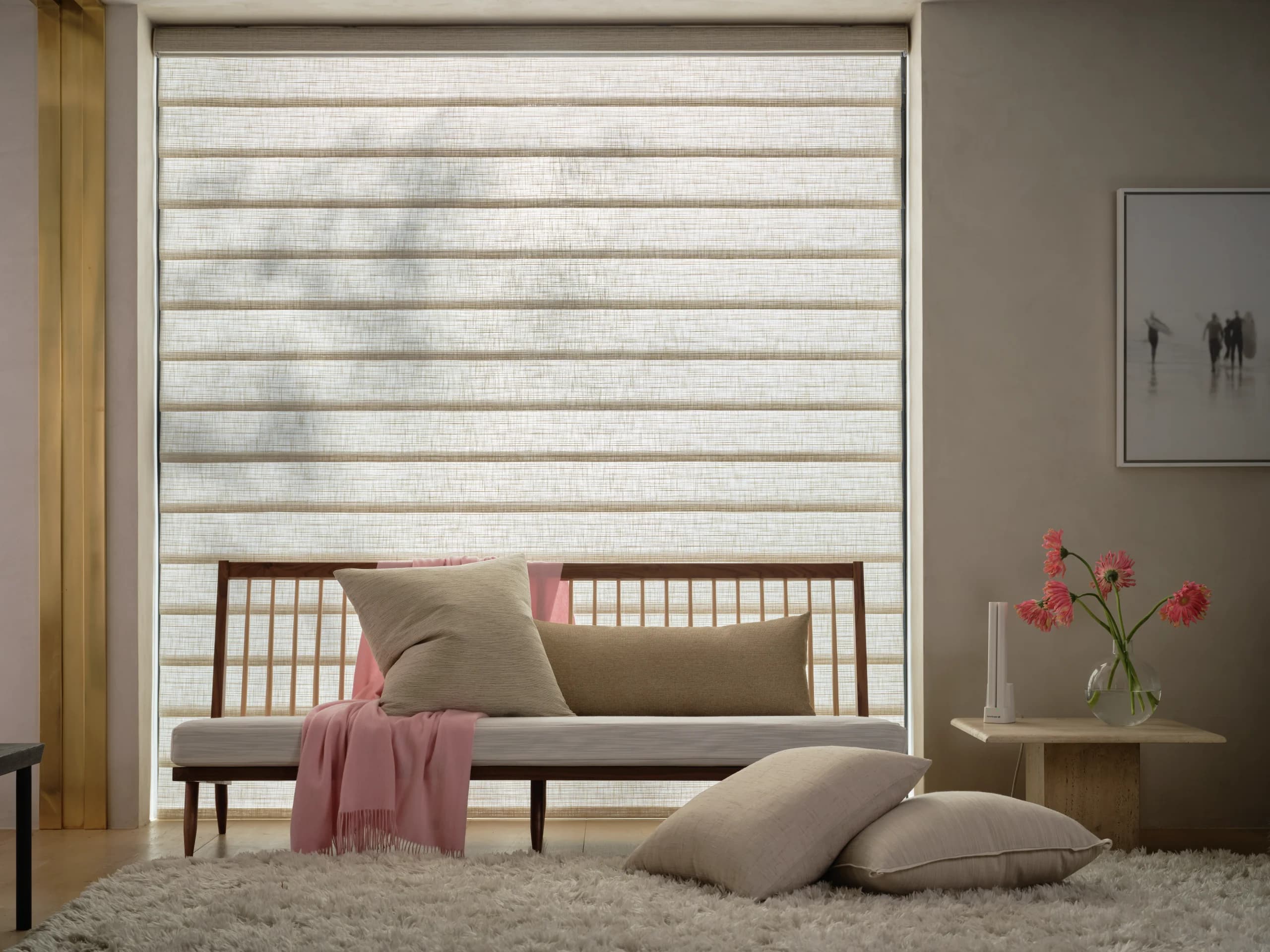 Hunter Douglas Vignette® Modern Roman Shades lowered in a sitting room, the tailored folds holding their shape.