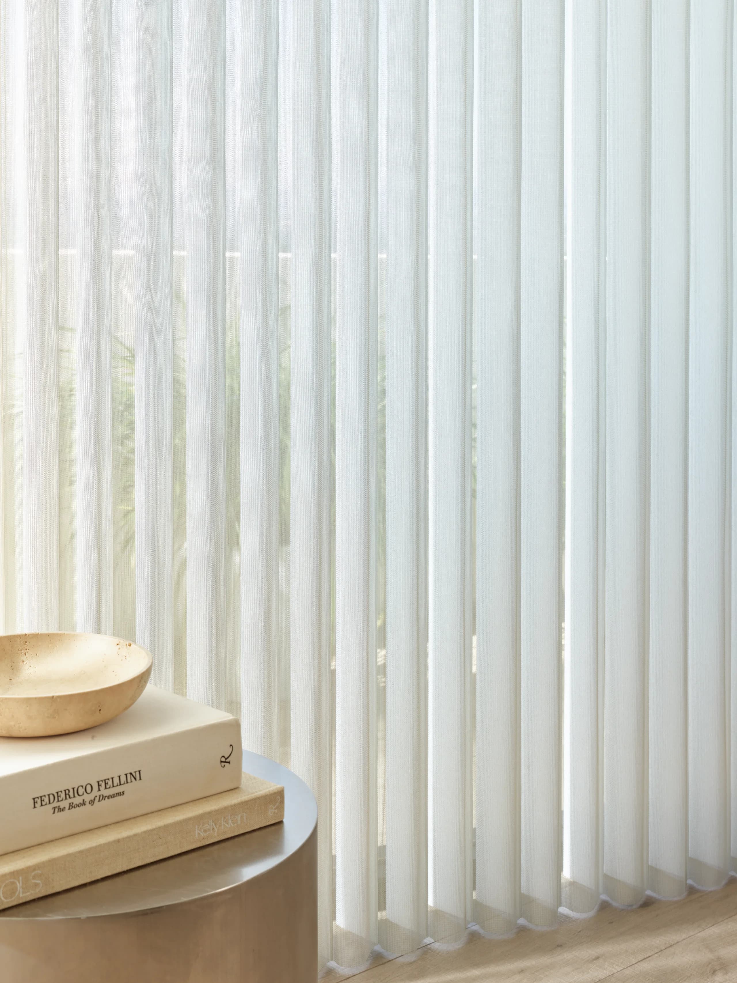 Hunter Douglas Luminette® Privacy Sheers diffusing daylight across a wide New England window wall, measured and installed by Window Fantasies.