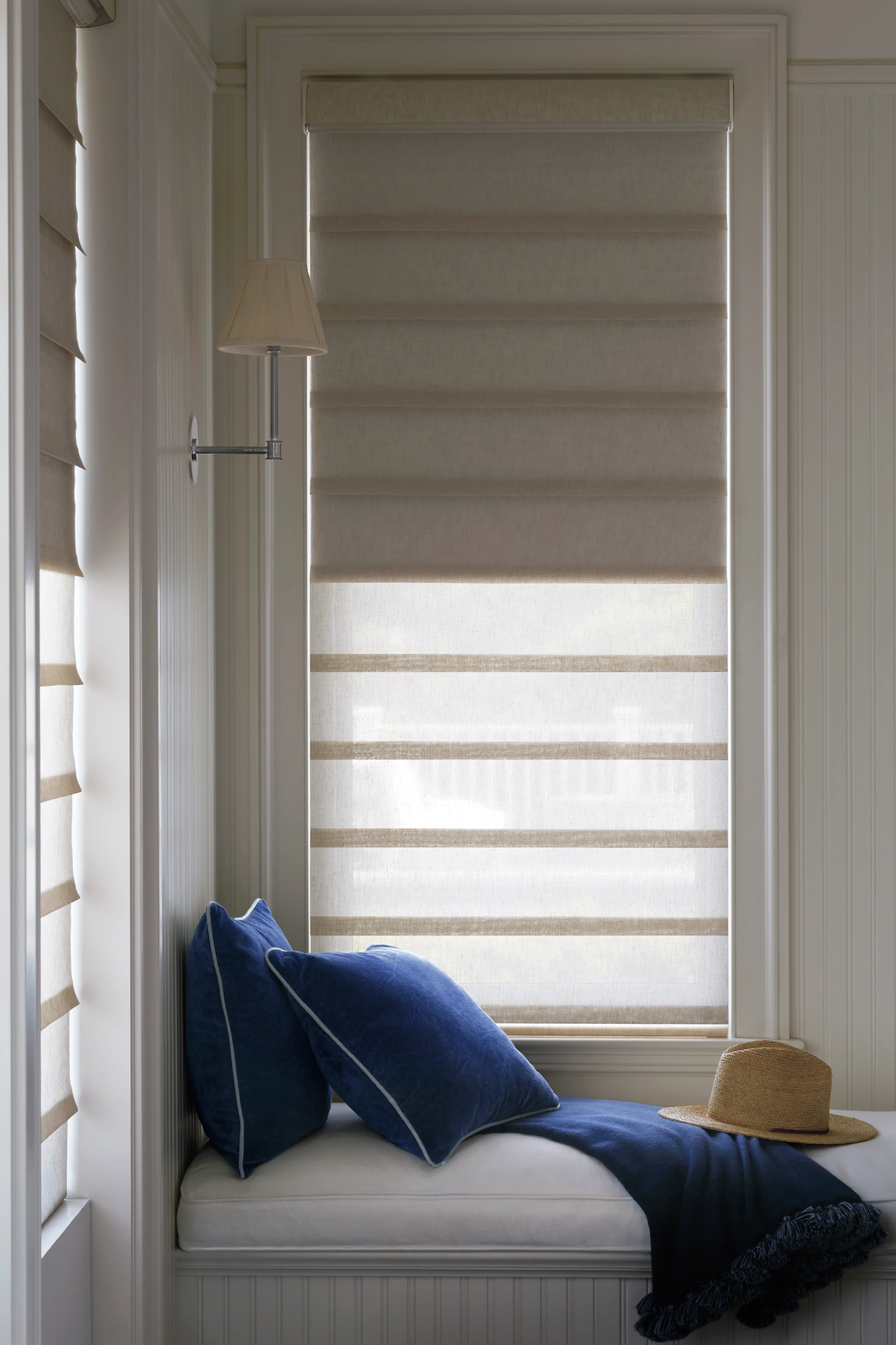 A navy drapery treatment in a modern loft with a city view.