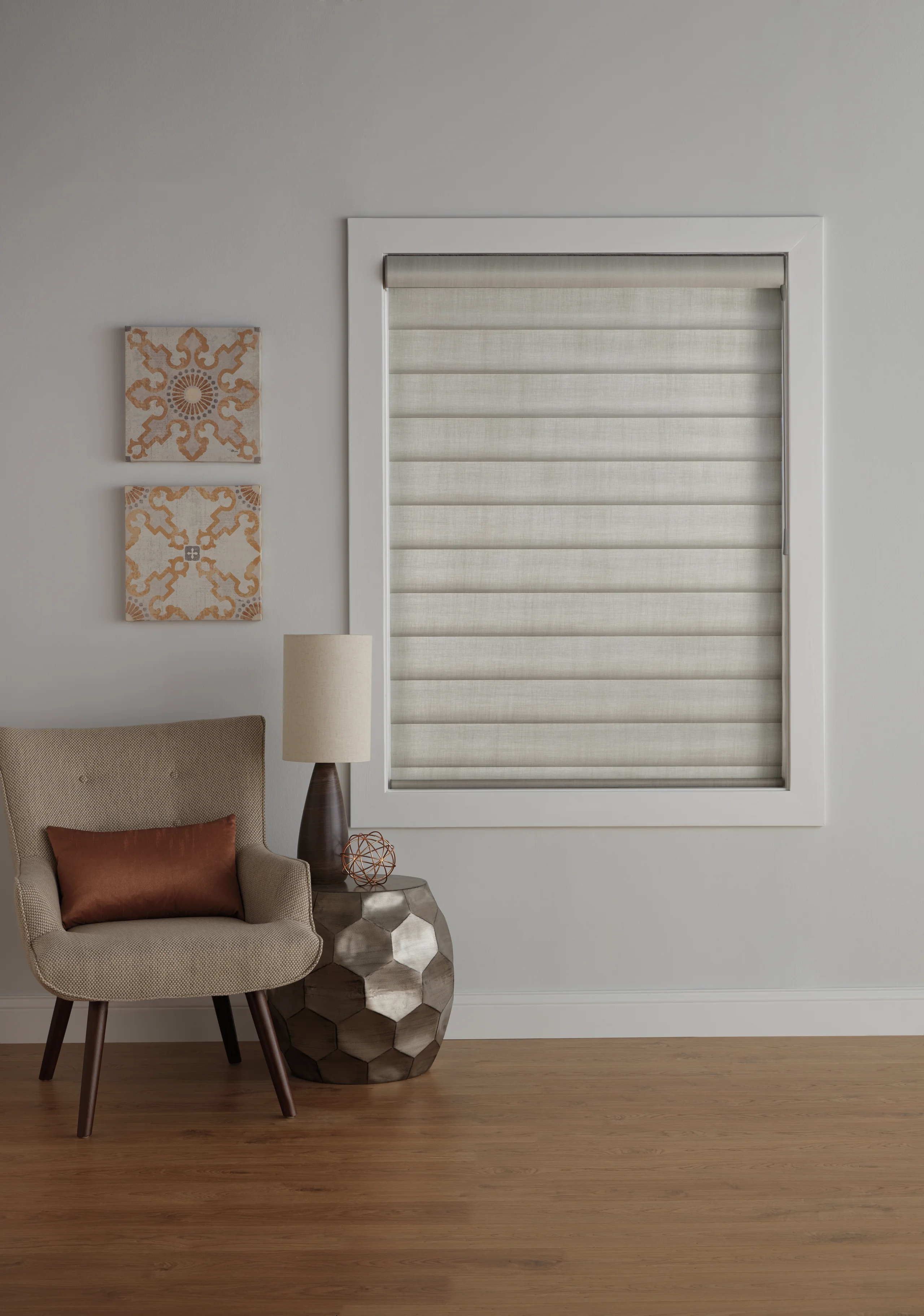 A refined room showing plantation shutters, cellular shades, and drapery together.