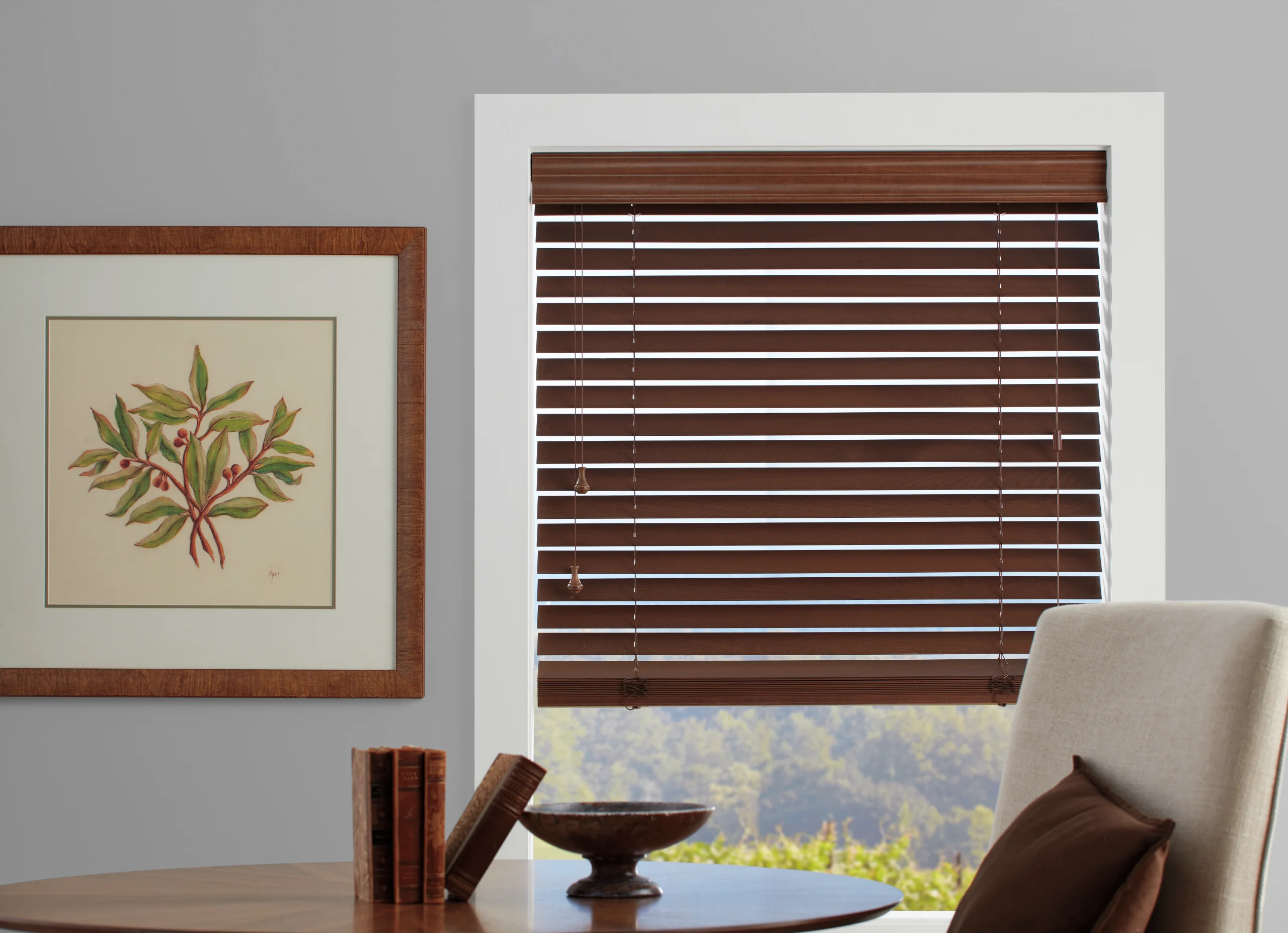 Hunter Douglas Parkland® Wood Blinds filtering afternoon light across a warm New England family room, measured and installed by Window Fantasies.
