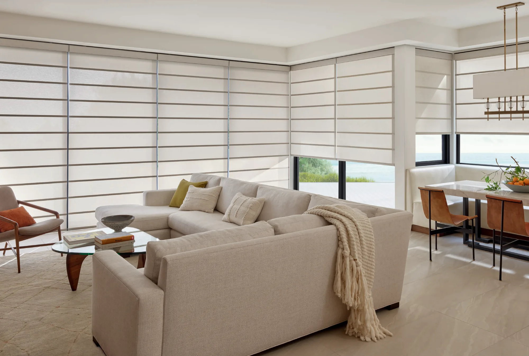 Alustra® Architectural Roller Shades in Hunter Douglas's Amelia fabric, color Dawn Drizzle, operated with PowerView® Automation.